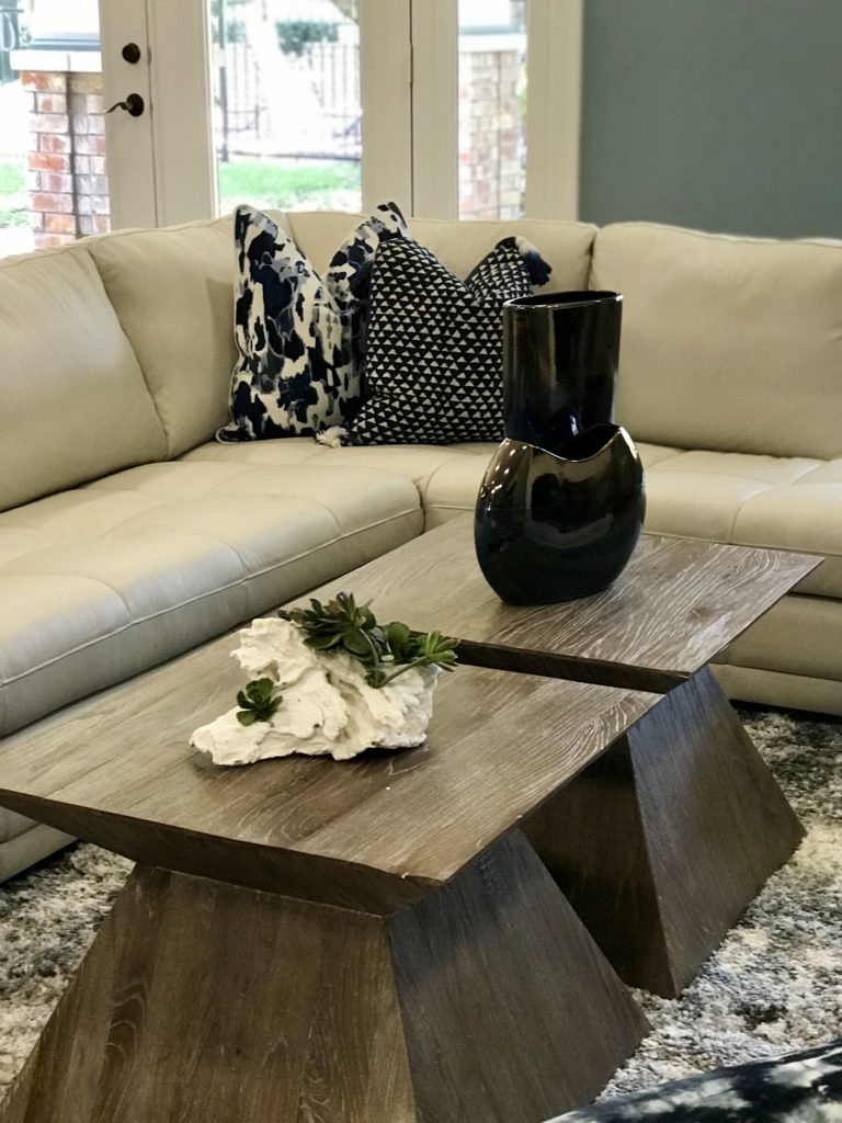 Living room with rustic wooden tables and home decors in neutral tones