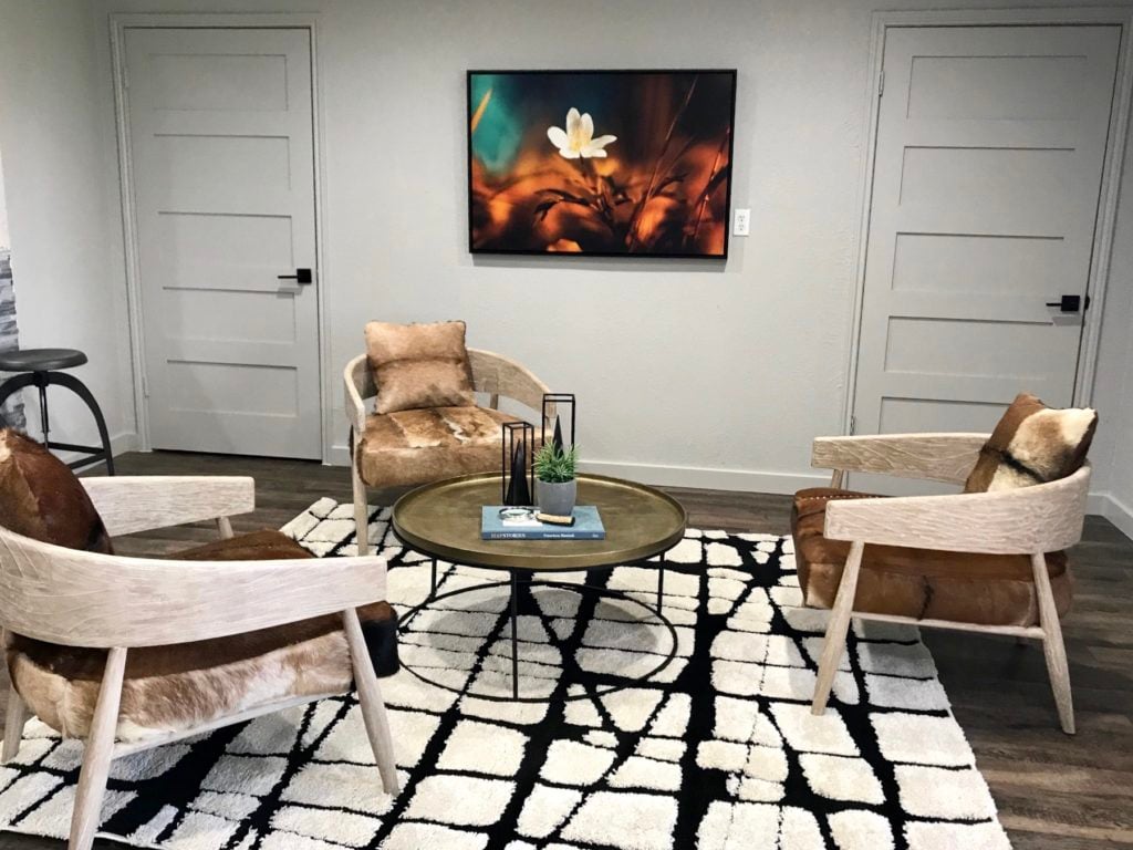 Rawhide chairs in waiting area of leasing office