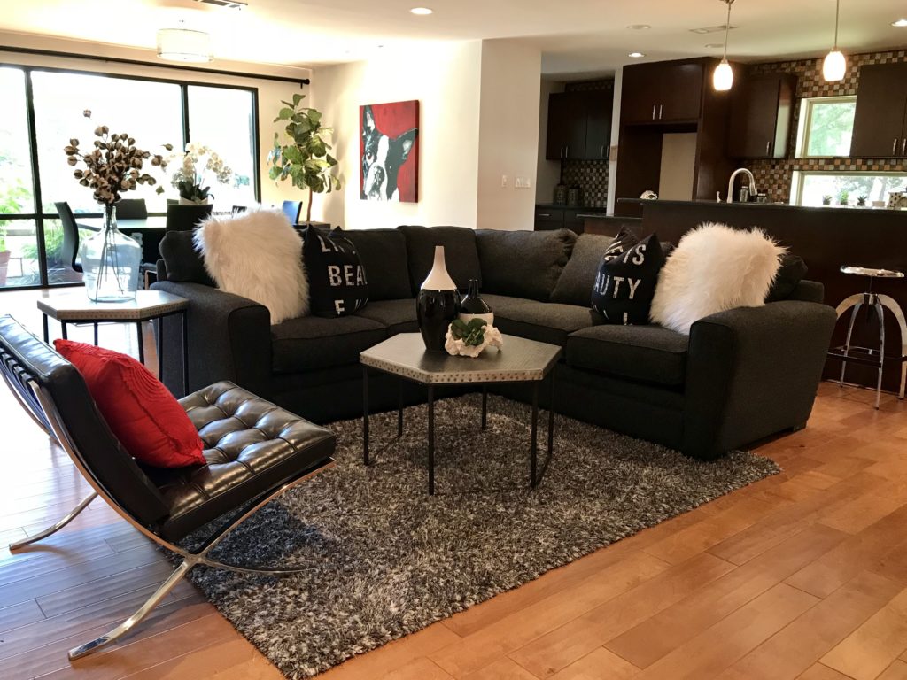 Stylish living room with couch, coffee table, and decorative pillows.