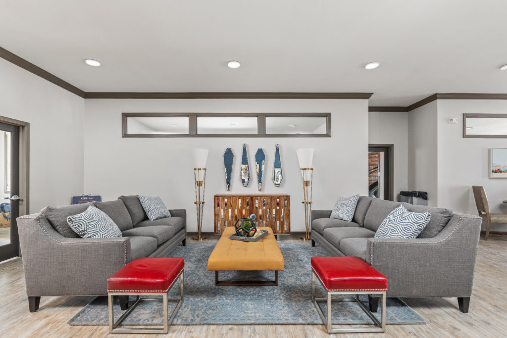 Living room in light gray and white concept with red accents