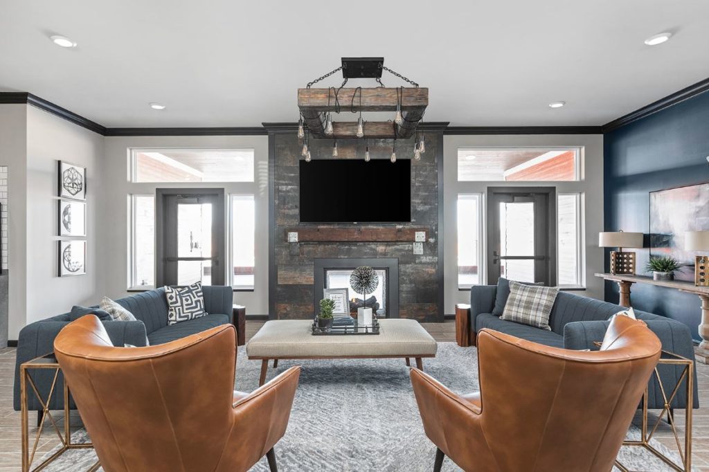 Clubroom redesign in Champaign Illinois with gray, blue and leather interiors