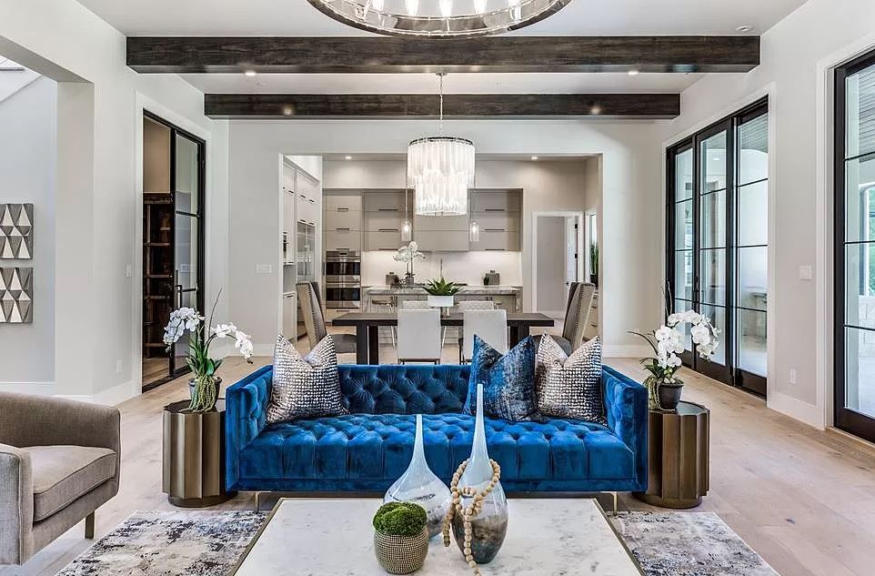 Rich blue velvets and gold accents in this luxury home staging.