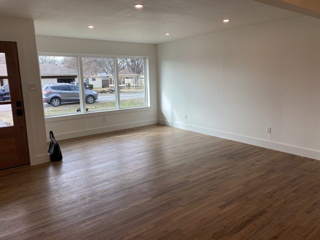 Vacant formal living room before the home staging