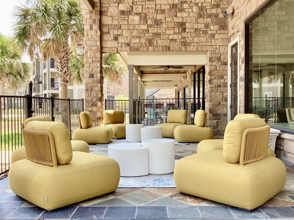 Comfy large yellow chairs on the outdoor patio