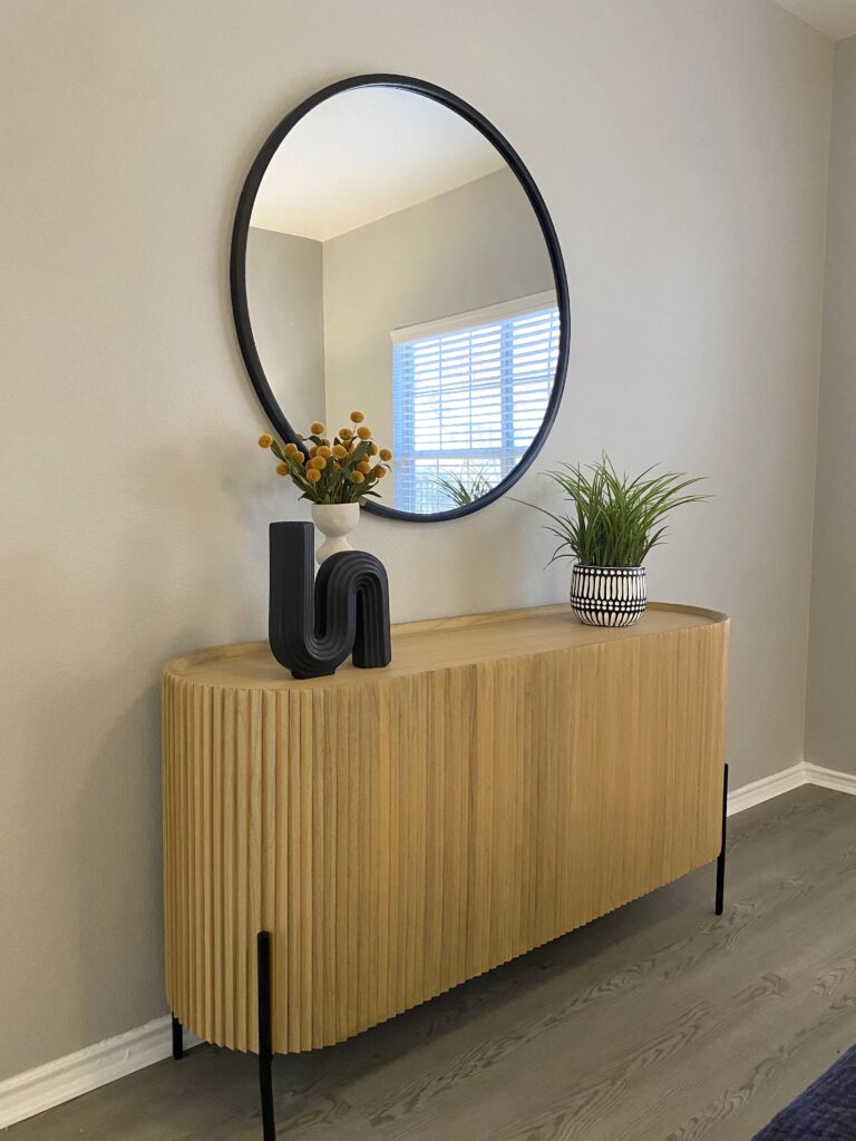 Entryway with a mirror, console table, and modern decor