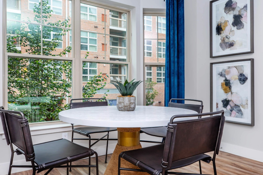 Dining room of custom model with round table and four leather chairs