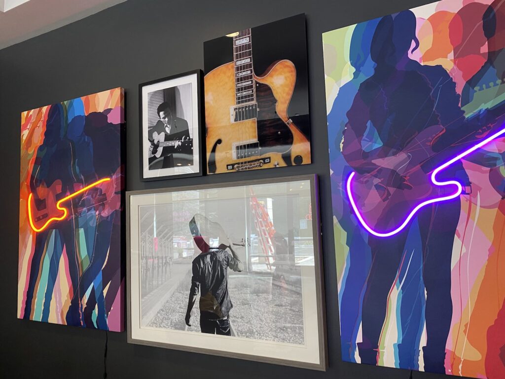 Guitar artwork in the main seating area of the clubroom redesign