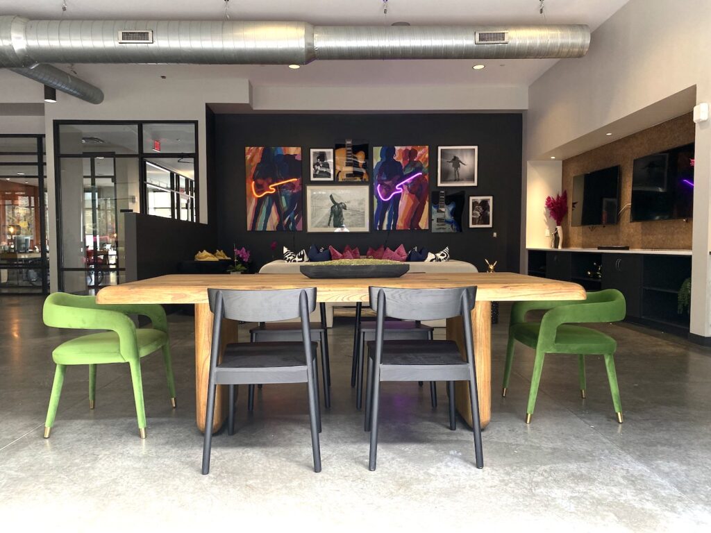 Clubroom Redesign in Nashville with a new dining area with sleek bright green chairs.