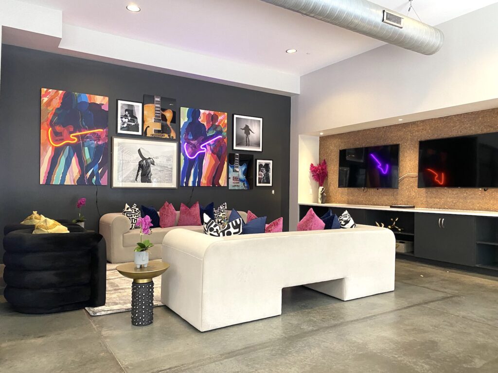 Clubroom redesign with modern furniture, neon artwork and pops of pink
