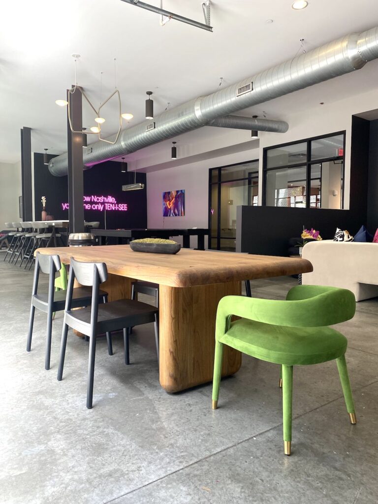 Clubroom redesign in Nashville with sleek bright green chairs in the dining area