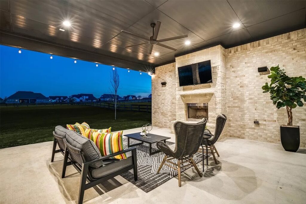 Outdoor patio staged with furniture, outdoor rug