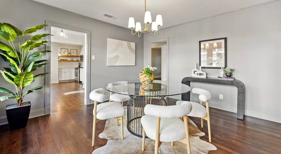 Home Staging of Tudor Home in Dallas - The dining room with light and modern furnishings