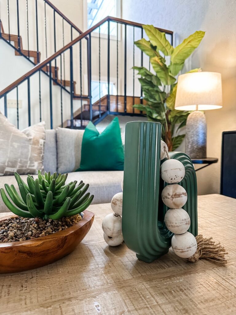 Home Staging close up of coffee table with green accessories