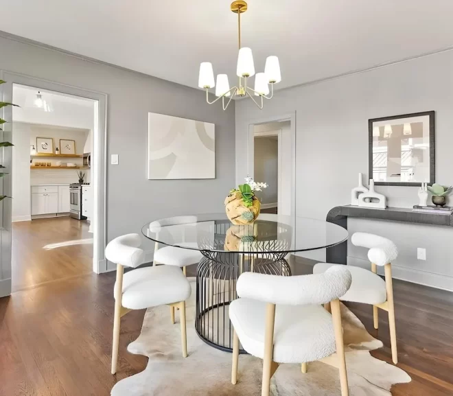 Home staging in Dallas of modern dining room with glass round table and white chairs