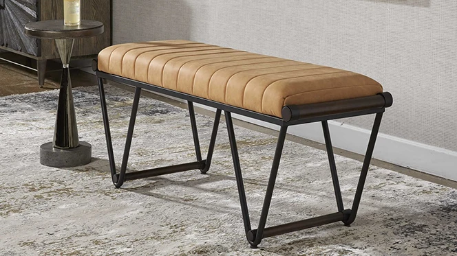 Contemporary bench with iron frame in matte black topped with a rich camel faux suede cushion