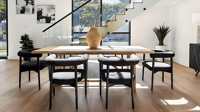 Large square modern dining table with six black boucle chairs