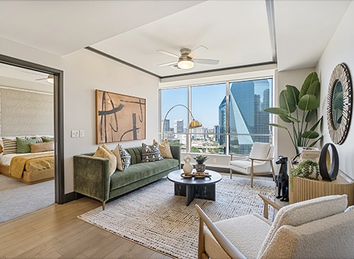 Modern living room with green, gold and white furnishings