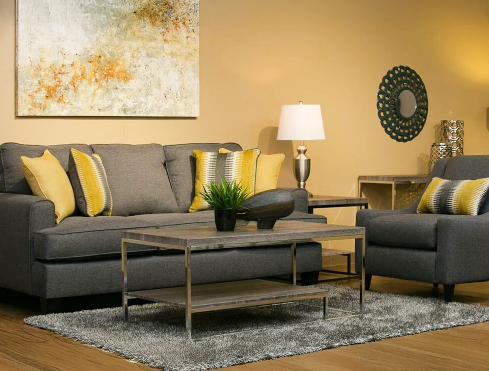 Living room furniture with grey sofa and yellow pillows