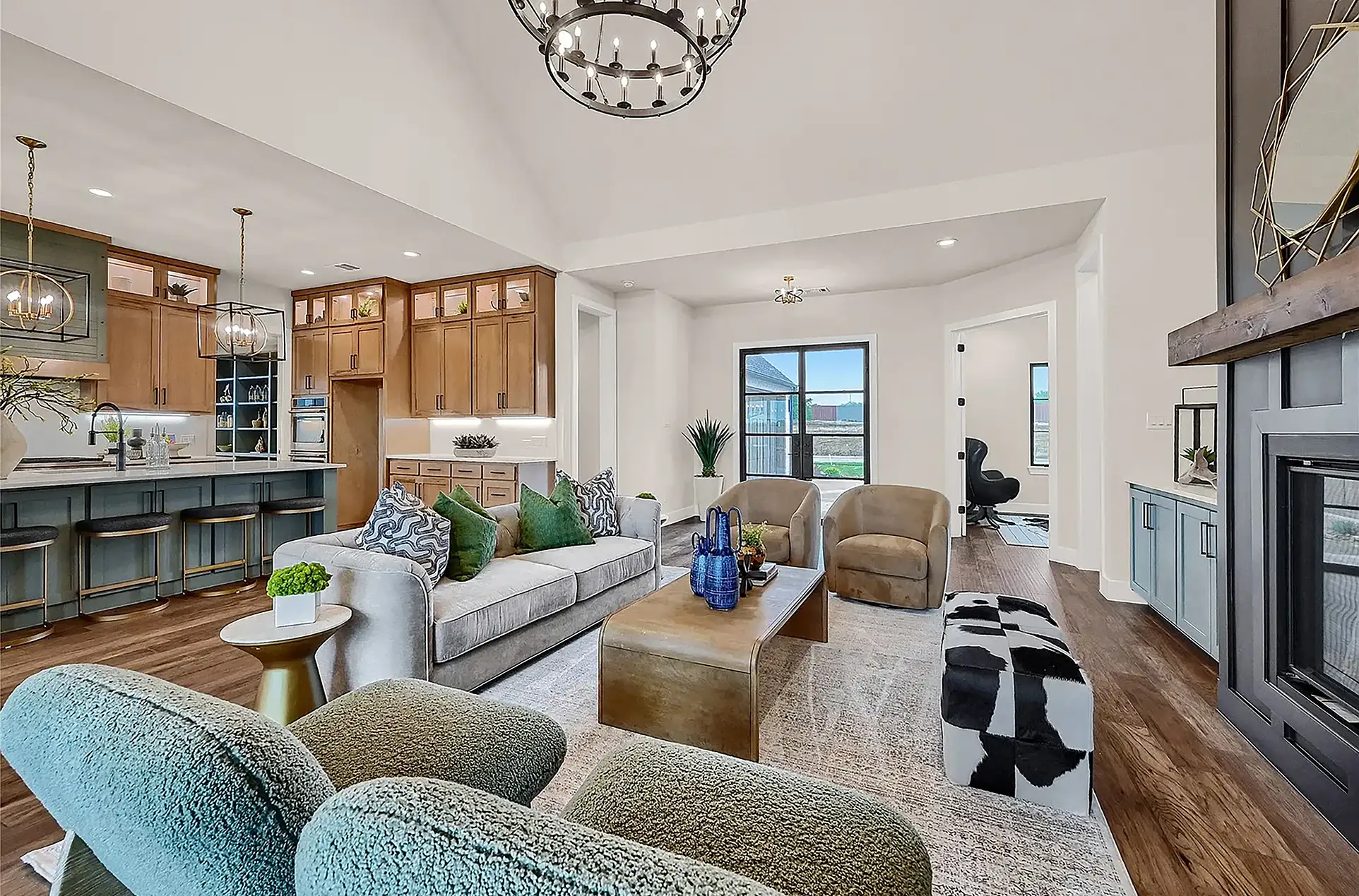 Staged living room with a sofa, coffee table, chair, rug and accessories