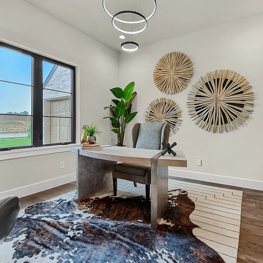 Staged home office with desk, chair, cowhide rug