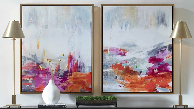 Two abstract paintings with orange, blue and fushia colors and two gold lammps